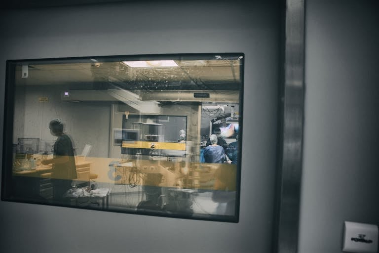 A glimpse into a surgery room, showcasing healthcare professionals at work.